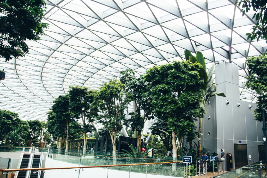 Explore the lush indoor garden and iconic architecture at Jewel Changi Airport in Singapore.